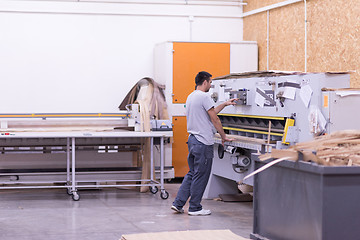 Image showing worker in a factory of wooden furniture