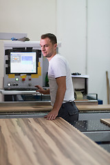 Image showing worker in a factory of wooden furniture