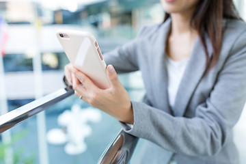 Image showing Businesswoman working on mobile phone at outdoor