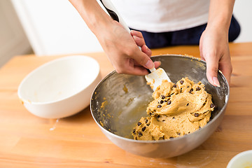 Image showing Stirring the paste in bowl