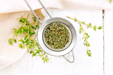 Image showing Thyme dry in strainer on board top