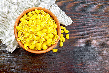 Image showing Elbow macaroni in bowl on board top