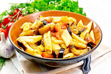 Image showing Pasta penne with eggplant and tomatoes on towel