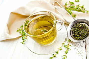 Image showing Tea of thyme in cup on board