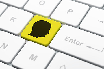 Image showing Advertising concept: Head on computer keyboard background