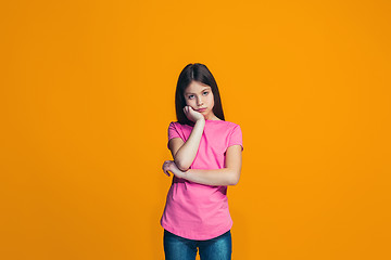 Image showing Young serious thoughtful teen girl. Doubt concept.