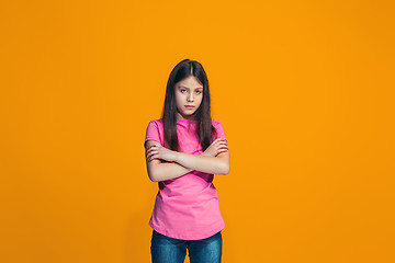 Image showing Young serious thoughtful teen girl. Doubt concept.