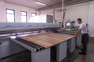 Image showing worker in a factory of wooden furniture