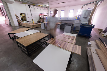 Image showing worker in a factory of wooden furniture