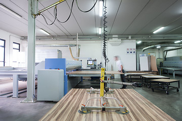 Image showing worker in a factory of wooden furniture