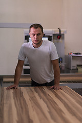 Image showing worker in a factory of wooden furniture