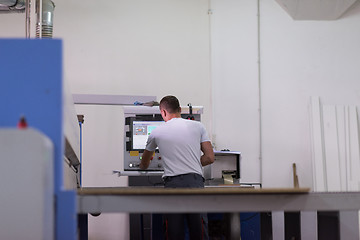 Image showing worker in a factory of wooden furniture