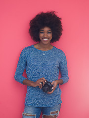 Image showing young black girl taking photo on a retro camera