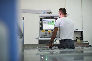 Image showing worker in a factory of wooden furniture