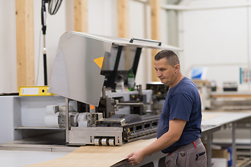 Image showing worker in a factory of wooden furniture