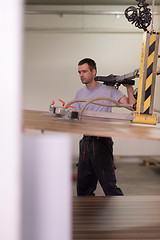 Image showing worker in a factory of wooden furniture