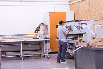 Image showing worker in a factory of wooden furniture