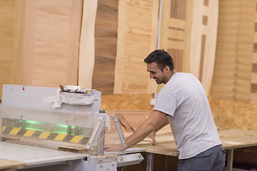 Image showing worker in a factory of wooden furniture