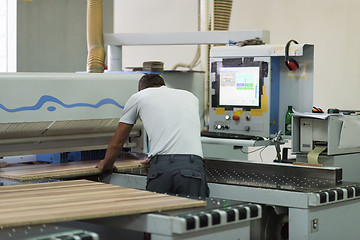 Image showing worker in a factory of wooden furniture