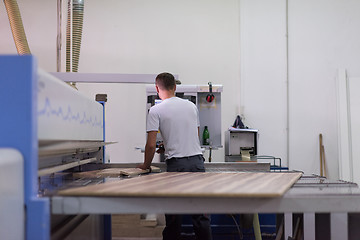 Image showing worker in a factory of wooden furniture