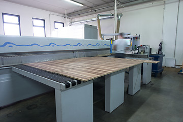 Image showing worker in a factory of wooden furniture