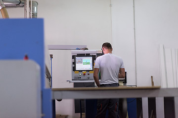 Image showing worker in a factory of wooden furniture