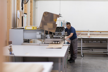 Image showing worker in a factory of wooden furniture