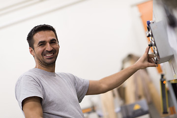 Image showing worker in a factory of wooden furniture