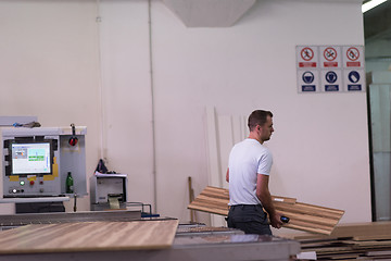 Image showing worker in a factory of wooden furniture