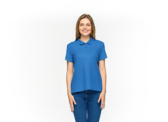 Image showing Closeup of young woman\'s body in empty blue t-shirt isolated on white background. Mock up for disign concept