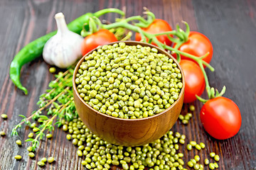 Image showing Mung beans  in bowl with vegetables and thyme on dark board