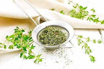 Image showing Thyme dry in strainer on board