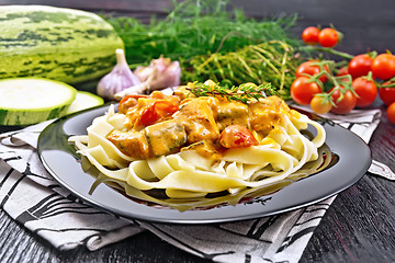 Image showing Pasta with goulash in plate on wooden board