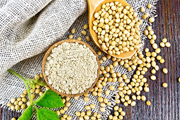 Image showing Flour soy in bowl with spoon on dark board top