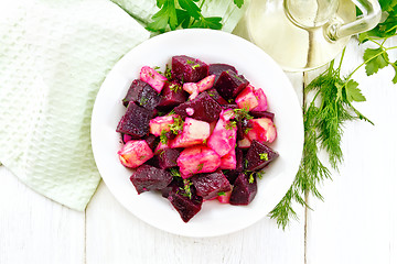 Image showing Salad of beets and potatoes in plate on light board top