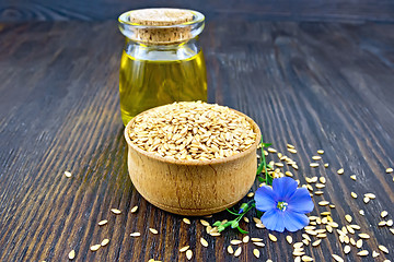 Image showing Flaxen white seed in bowl with oil on board