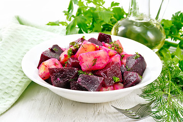 Image showing Salad of beets and potatoes in plate on table