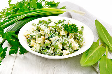 Image showing Salad with potatoes and sorrel on light board