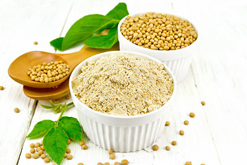 Image showing Flour soy with soybeans and leaf on light wooden board