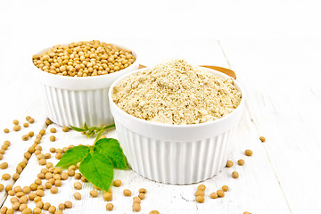 Image showing Flour soy with soybeans and leaf on light board