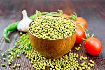 Image showing Mung beans  in bowl with vegetables and thyme on wooden board