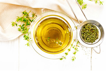 Image showing Tea of thyme in cup on board top