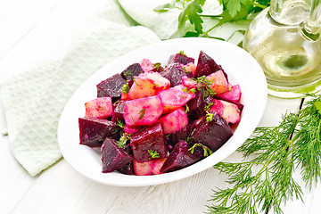 Image showing Salad of beets and potatoes in plate on light table