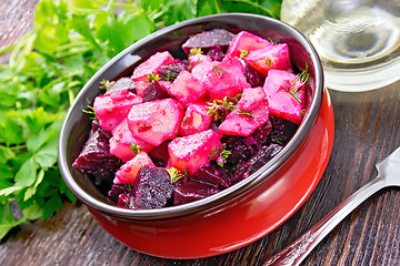 Image showing Salad of beets and potatoes in bowl on board