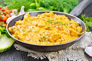 Image showing Goulash with tomato and zucchini in pan on table