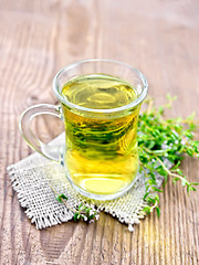 Image showing Tea of thyme in mug on board