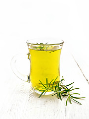 Image showing Tea of rosemary in mug on board