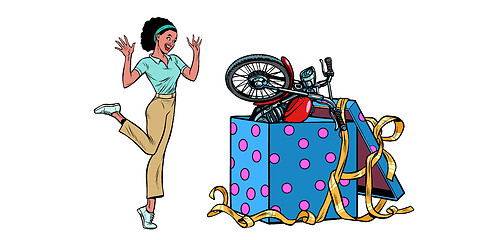 Image showing motorcycle holiday gift box. African woman funny reaction isolate on white background