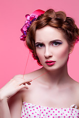 Image showing Beautiful girl with bright make-up and pink hat