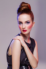 Image showing Beautiful girl with hairdo and bright make-up